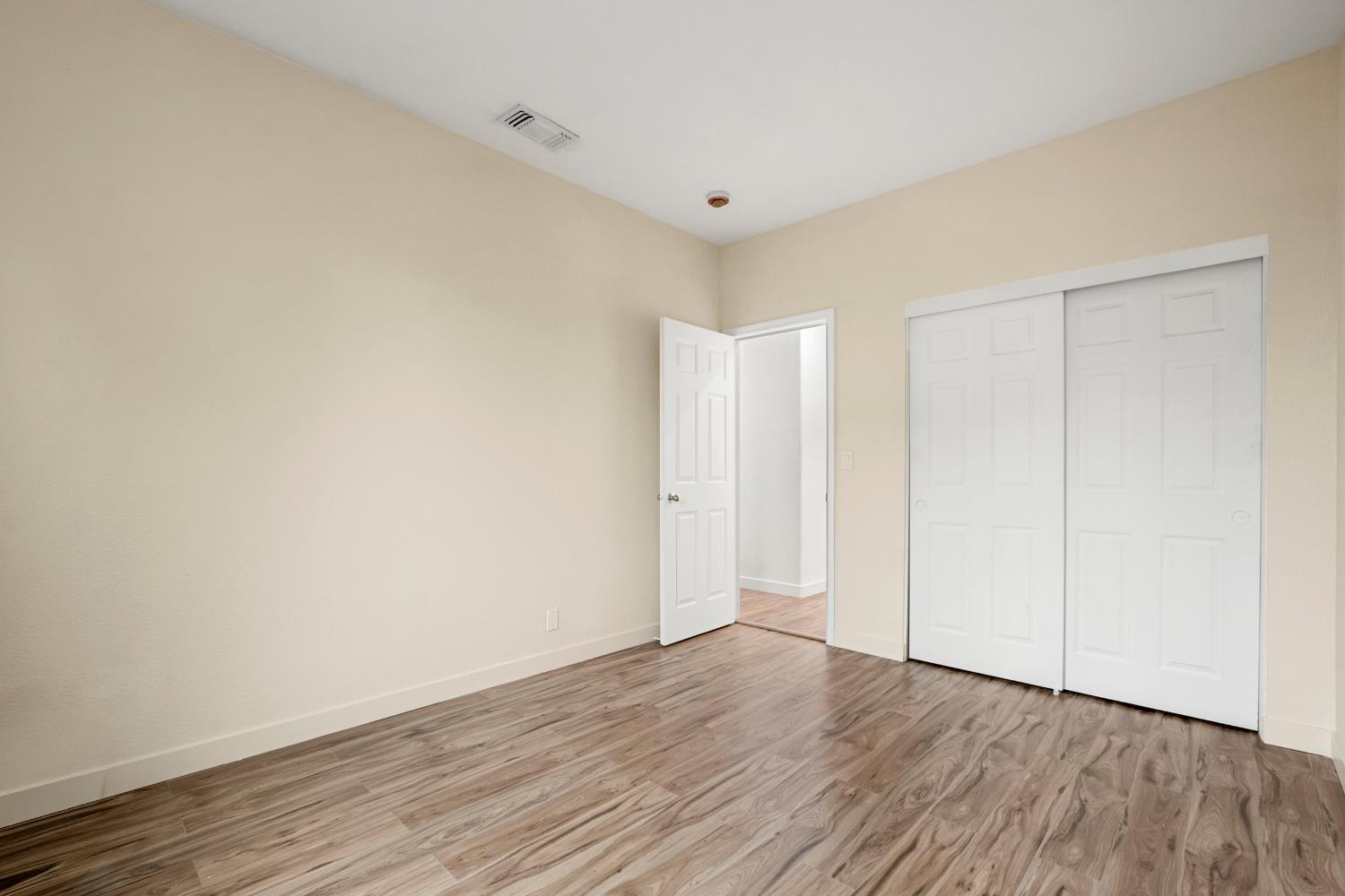 624 Snapdragon Street Winters, CA 95694 - Photo 25 of 65 a view of an empty room with wooden floor