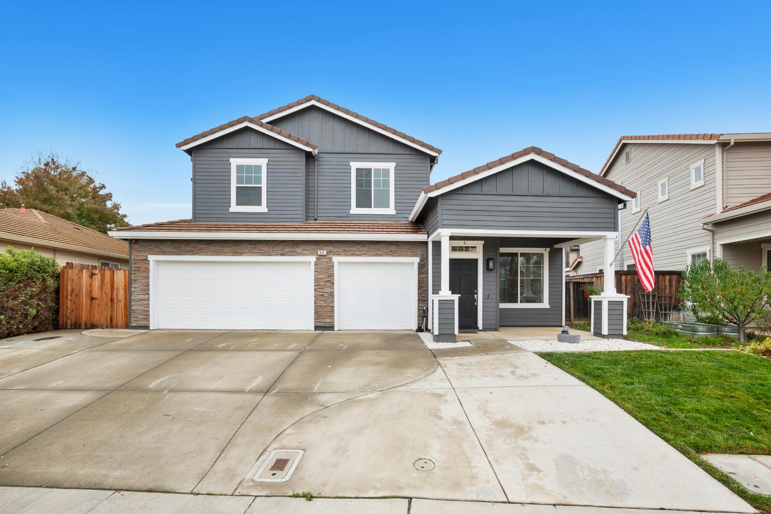 624 Snapdragon Street Winters, CA 95694 - Photo 3 of 65 a front view of a house with a yard and garage