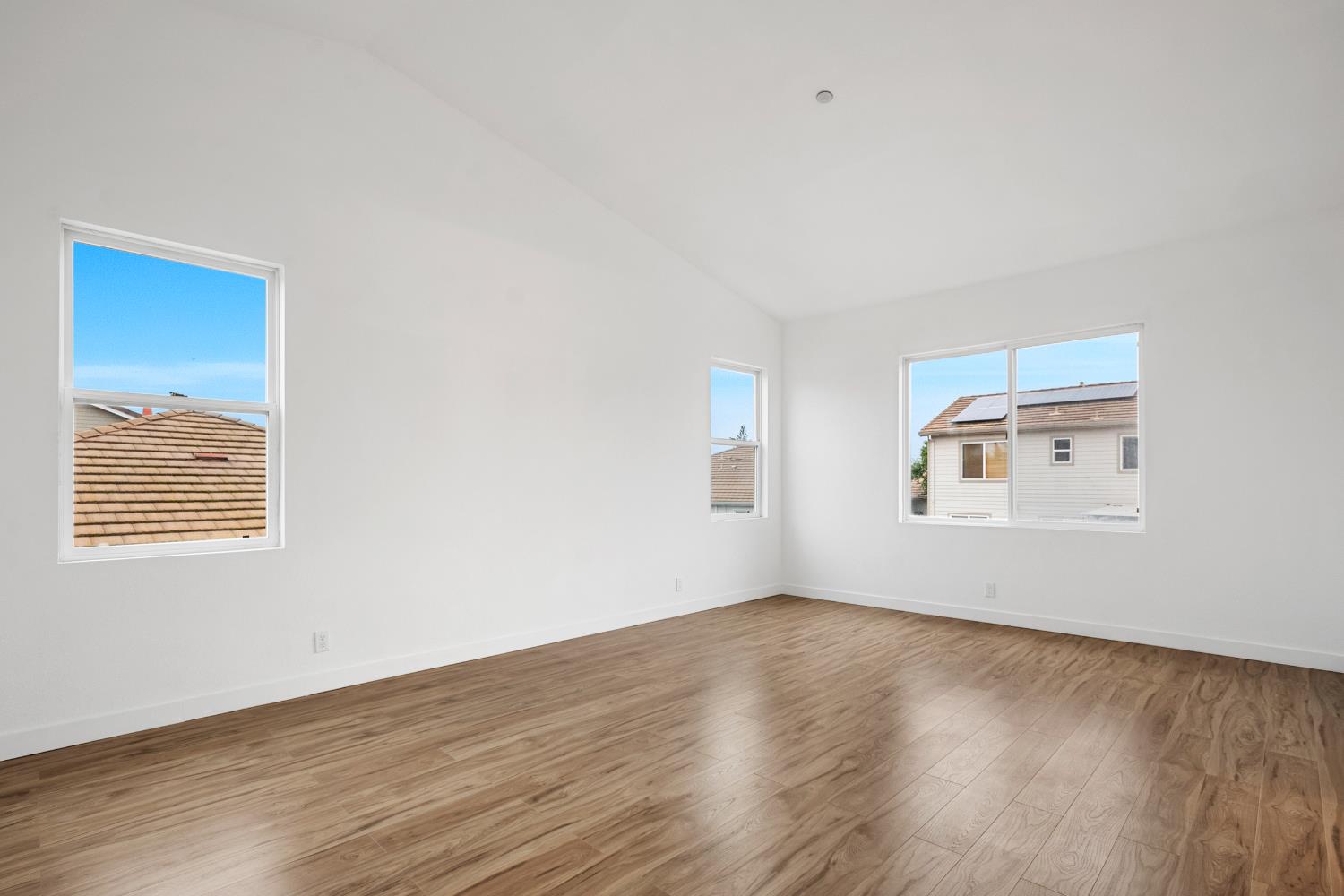 624 Snapdragon Street Winters, CA 95694 - Photo 35 of 65 a view of an empty room with wooden floor and a window
