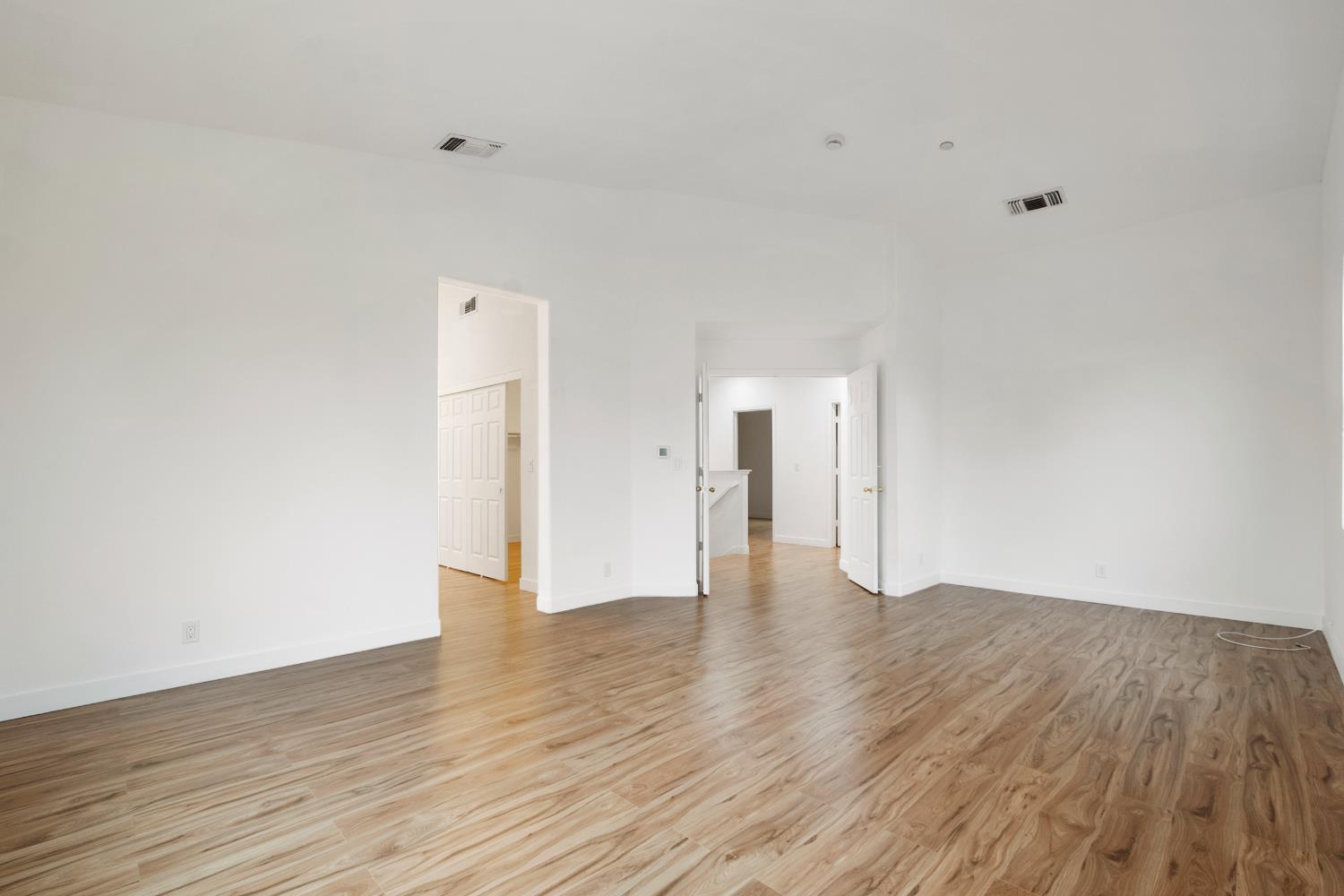 624 Snapdragon Street Winters, CA 95694 - Photo 37 of 65 a view of an empty room and wooden floor