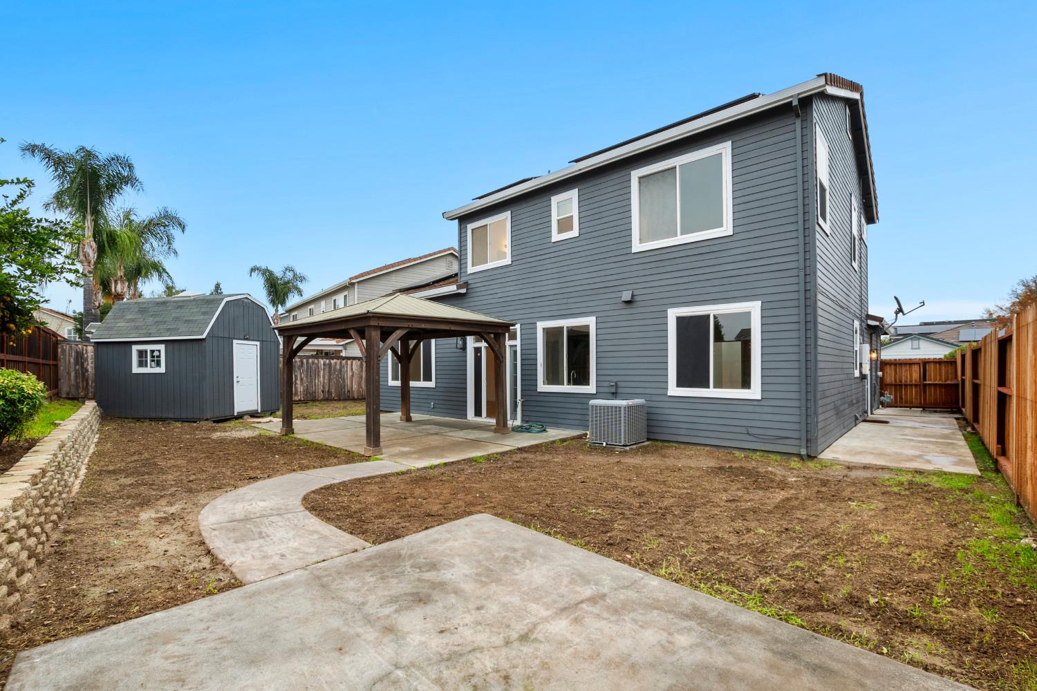 624 Snapdragon Street Winters, CA 95694 - Photo 45 of 65 a front view of a house with a yard and garage