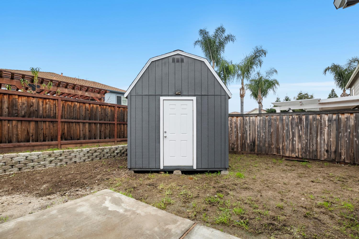 624 Snapdragon Street Winters, CA 95694 - Photo 47 of 65 a view of backyard with small cabin and wooden fence