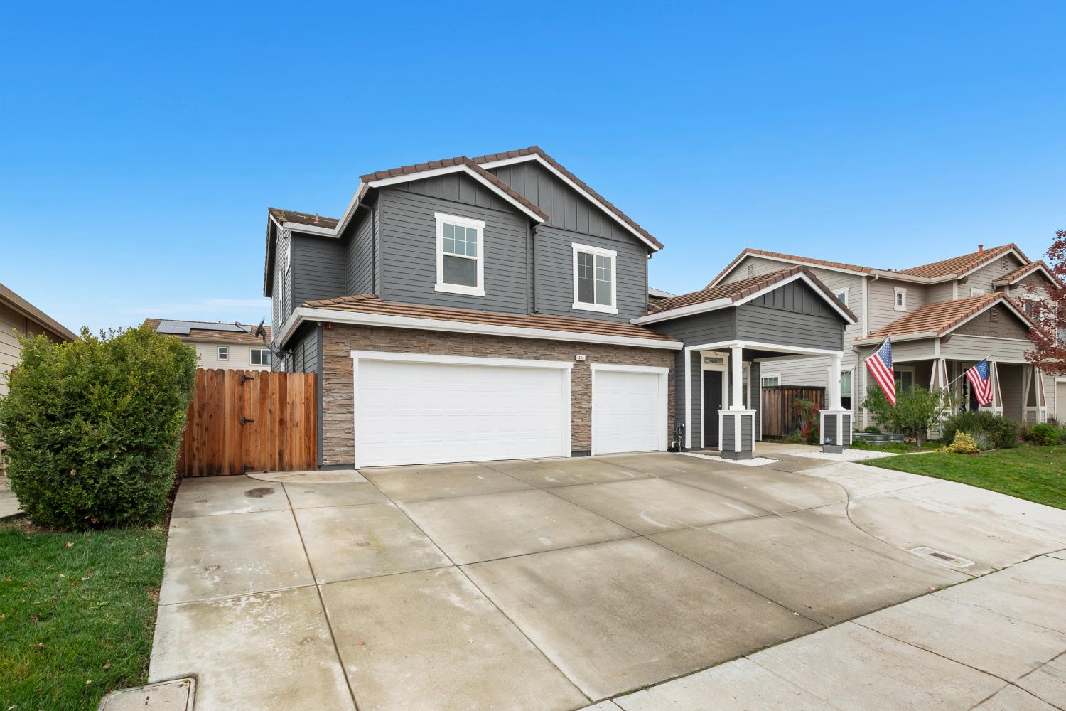 624 Snapdragon Street Winters, CA 95694 - Photo 52 of 65 a front view of a house with a yard and garage