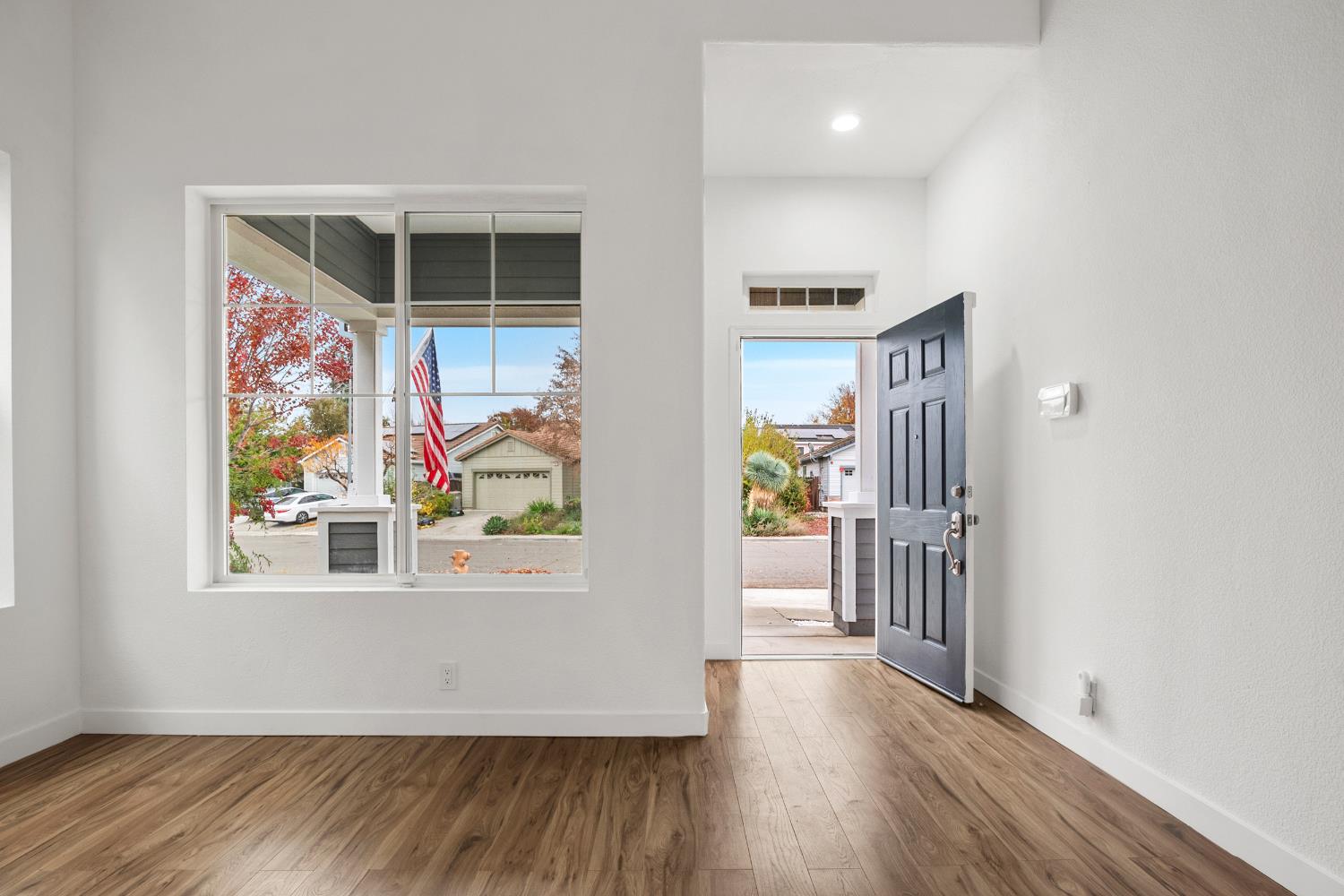 624 Snapdragon Street Winters, CA 95694 - Photo 7 of 65 a view of a hallway with wooden floor and front door