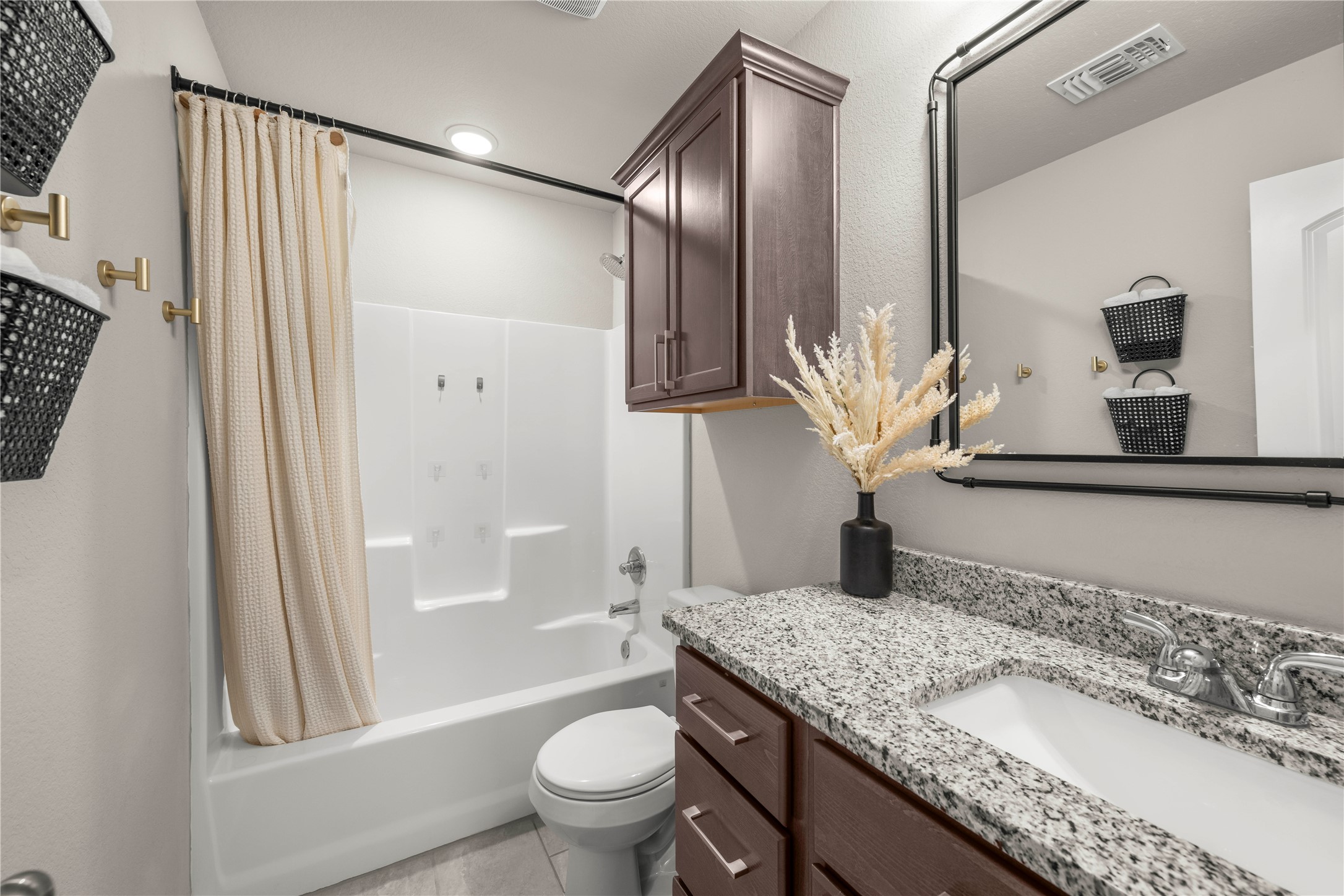 3018 Clevelander Drive Temple, TX 76504 - Photo 3 of 21 a bathroom with a granite countertop sink toilet and shower