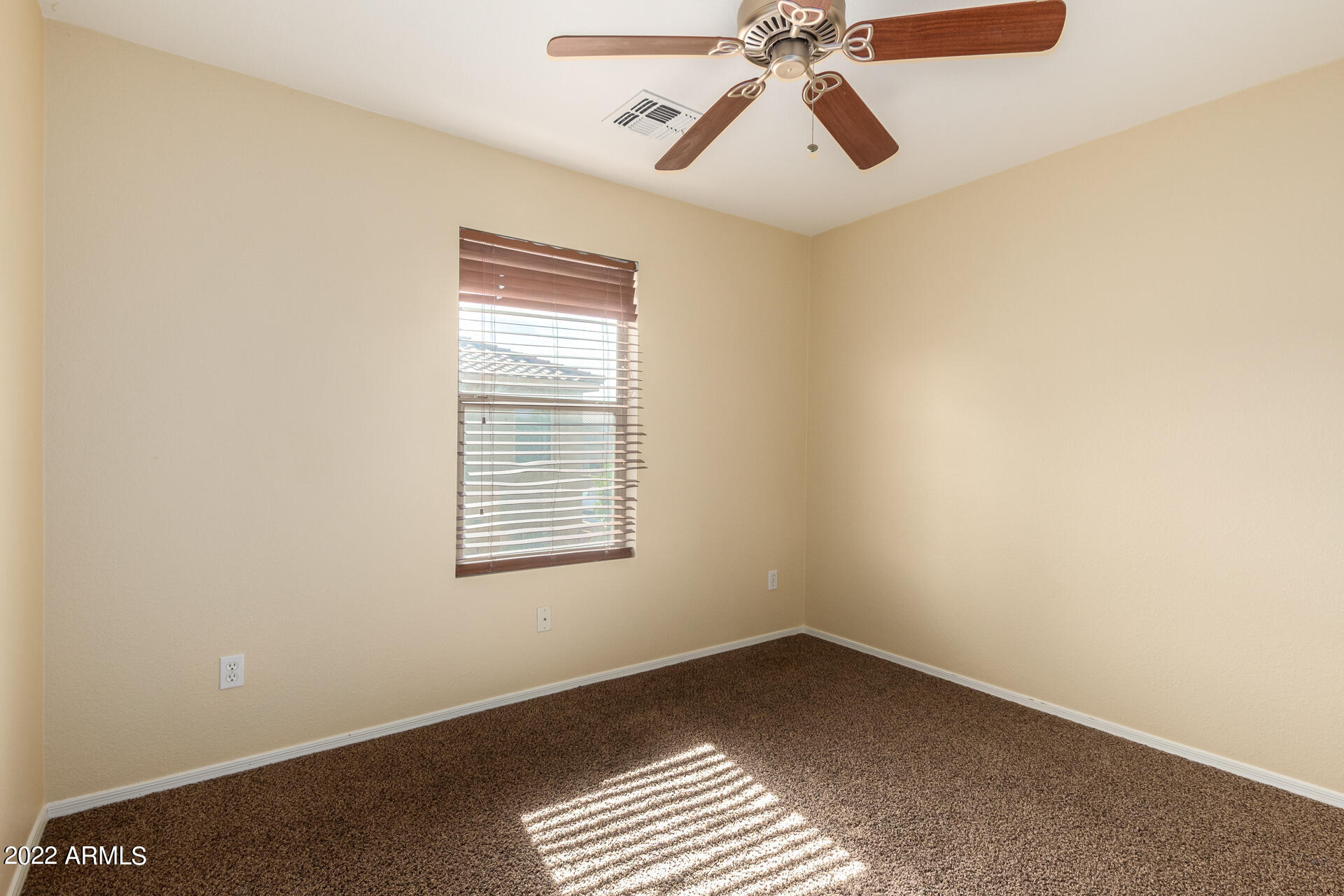 9373 West Eaton Road Phoenix, AZ 85037 - Photo 12 of 19 a view of an empty room with a window