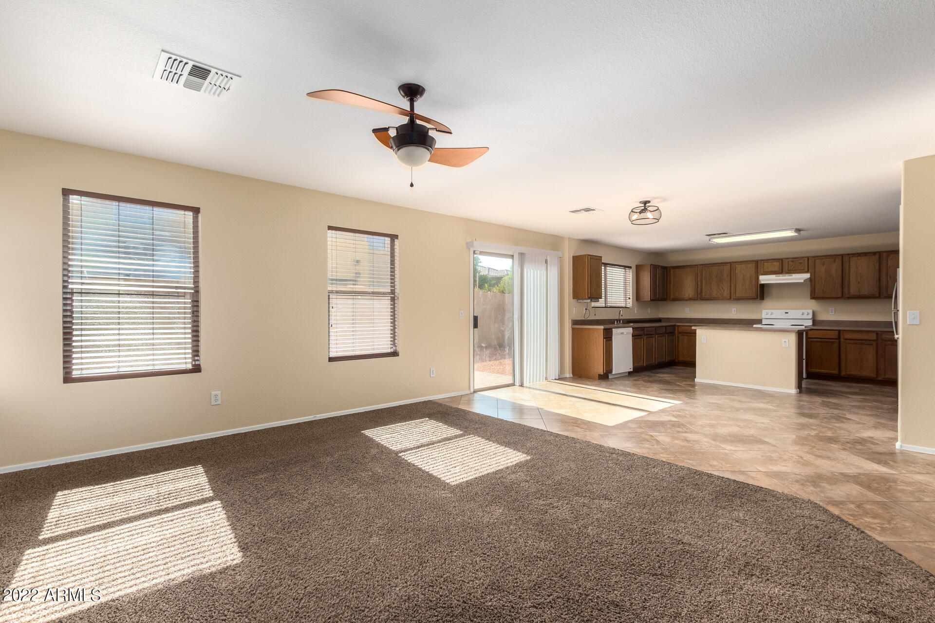 9373 West Eaton Road Phoenix, AZ 85037 - Photo 3 of 19 a view of an empty room with a window