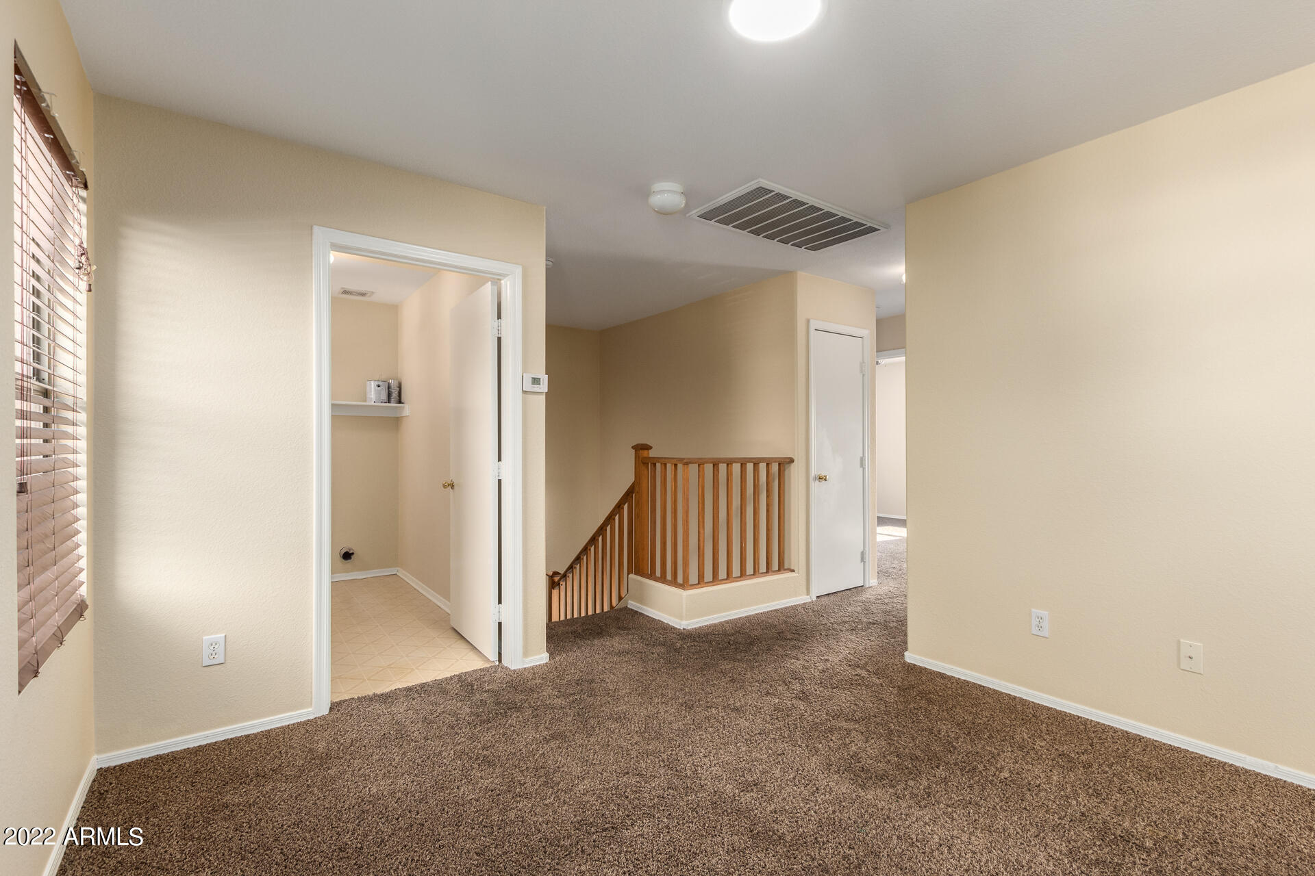 9373 West Eaton Road Phoenix, AZ 85037 - Photo 7 of 19 an empty room and windows