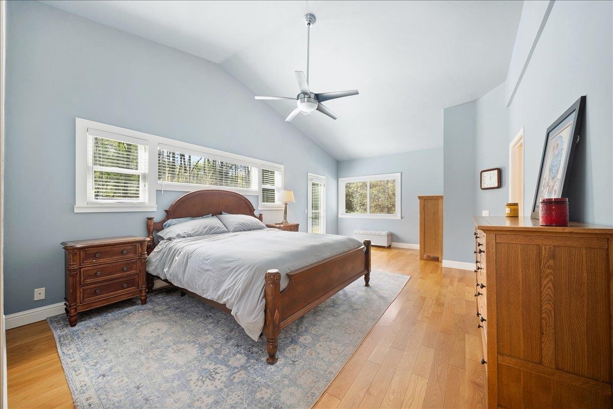 27769 Table Meadow Road Auburn, CA 95602 - Photo 12 of 43 a spacious bedroom with a bed flat screen tv and a window