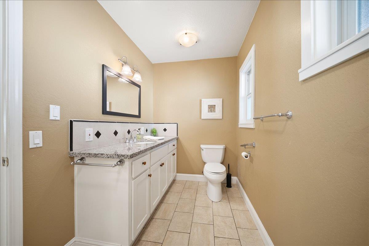 27769 Table Meadow Road Auburn, CA 95602 - Photo 21 of 43 a bathroom with a granite countertop sink and a mirror