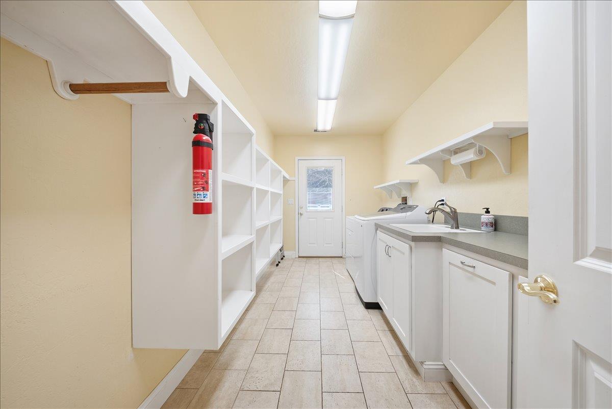 27769 Table Meadow Road Auburn, CA 95602 - Photo 23 of 43 a utility room with cabinets washer and dryer