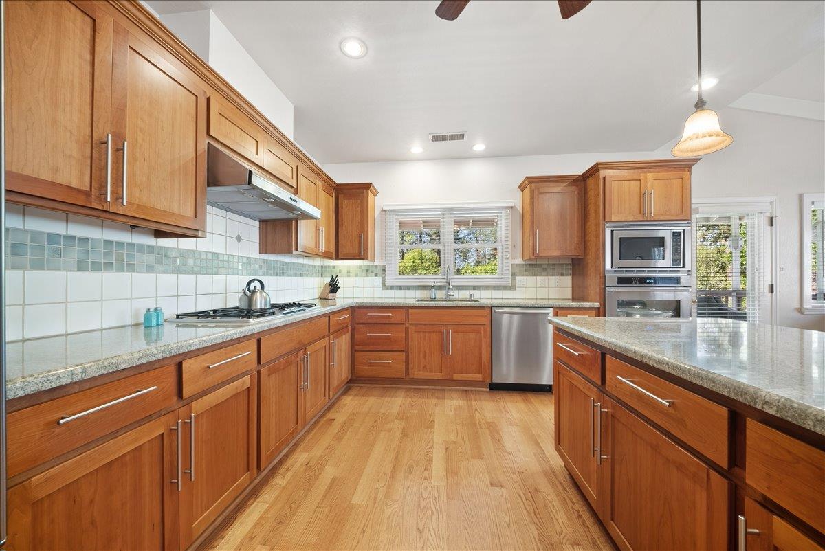 27769 Table Meadow Road Auburn, CA 95602 - Photo 10 of 43 a large kitchen with stainless steel appliances lots of counter space and a sink