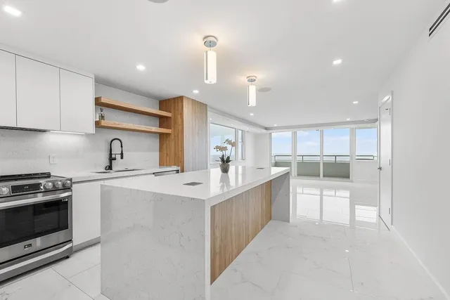 a kitchen with counter top space cabinets and stainless steel appliances