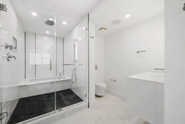 a bathroom with a sink a vanity and a mirror