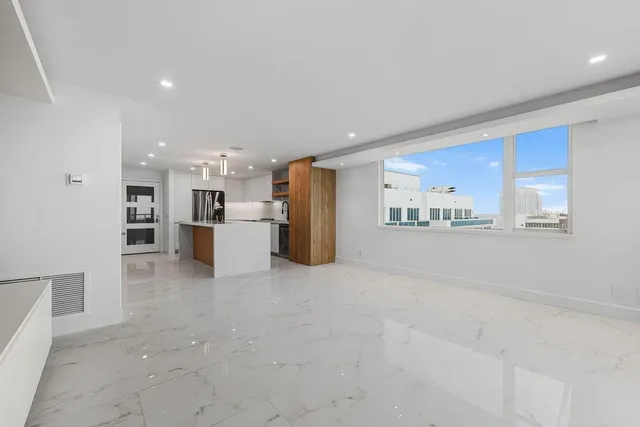 an empty room with closet and ceiling fan