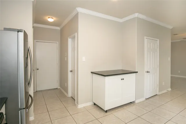 a view of bathroom with a shower and closet