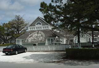 83 Wintergreen Road Mashpee, MA 02649 - Photo 16 of 18 a view of house with a outdoor space