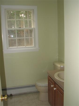10 Rowley Hill Road Sterling, MA 01564 - Photo 14 of 29 a bathroom with a toilet a sink and shower