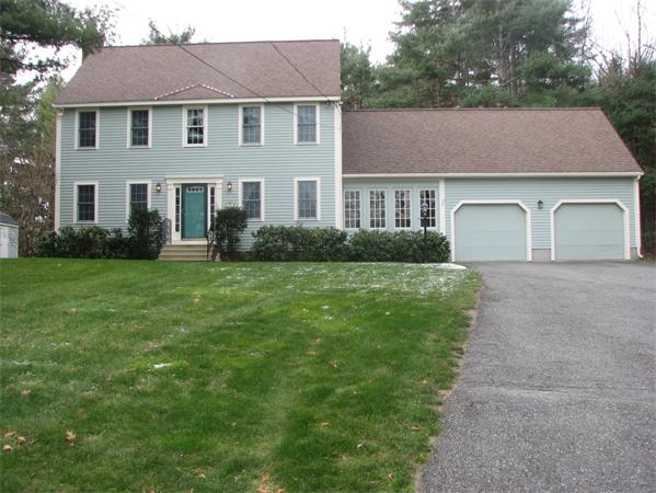10 Rowley Hill Road Sterling, MA 01564 - Photo 2 of 29 a front view of a house with a yard and garage