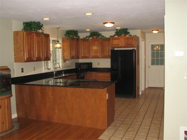 10 Rowley Hill Road Sterling, MA 01564 - Photo 5 of 29 a kitchen with stainless steel appliances granite countertop a refrigerator a sink and a stove