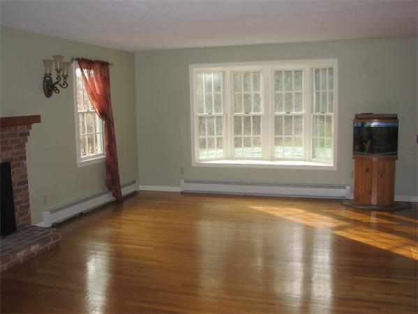 10 Rowley Hill Road Sterling, MA 01564 - Photo 10 of 29 a view of a livingroom with wooden floor and a window