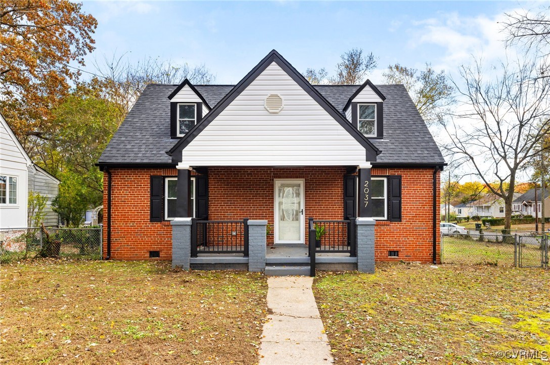 2037 Orlando Road Richmond, VA 23224 - Photo 1 of 1 a front view of a house with a yard