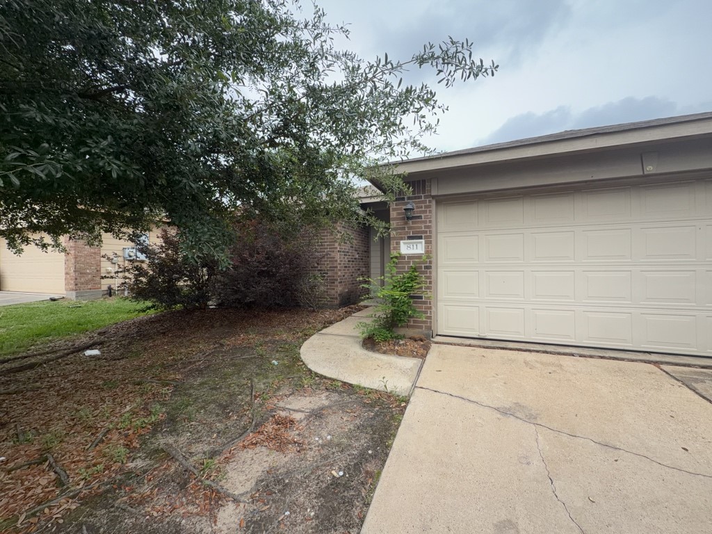 a backyard of a house with a yard and garage