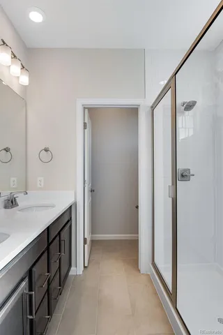 a bathroom with a double vanity sink a and mirror
