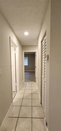 a view of an empty room and fire place