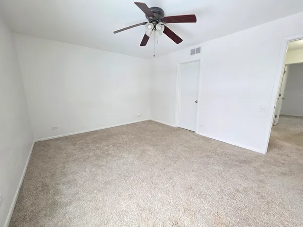 a view of a big room with carpet