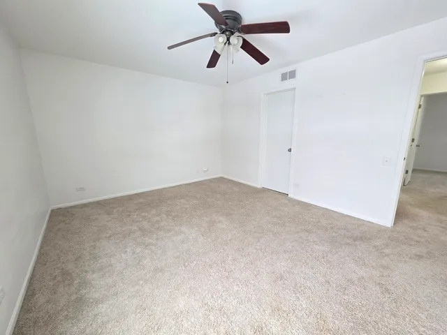 a view of a big room with carpet
