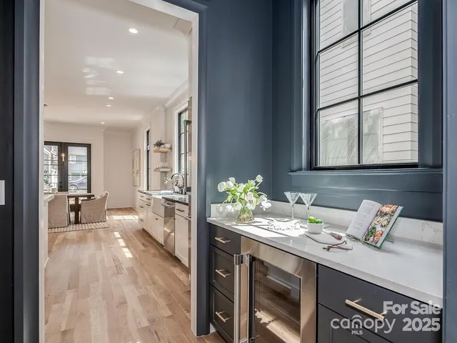 a spacious bathroom with a granite countertop sink and a large mirror