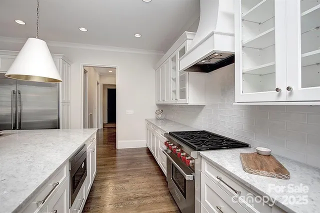 a kitchen with a stove and a refrigerator
