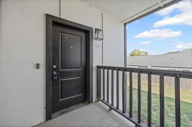 a view of a balcony from a hallway