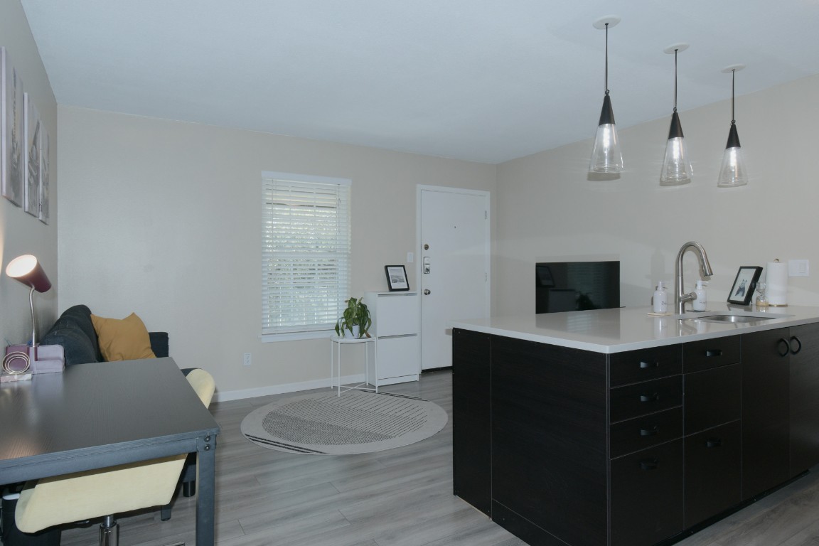 2302 East Side Drive, Unit 6 Austin, TX 78704 - Photo 2 of 7 a living room with furniture and a flat screen tv