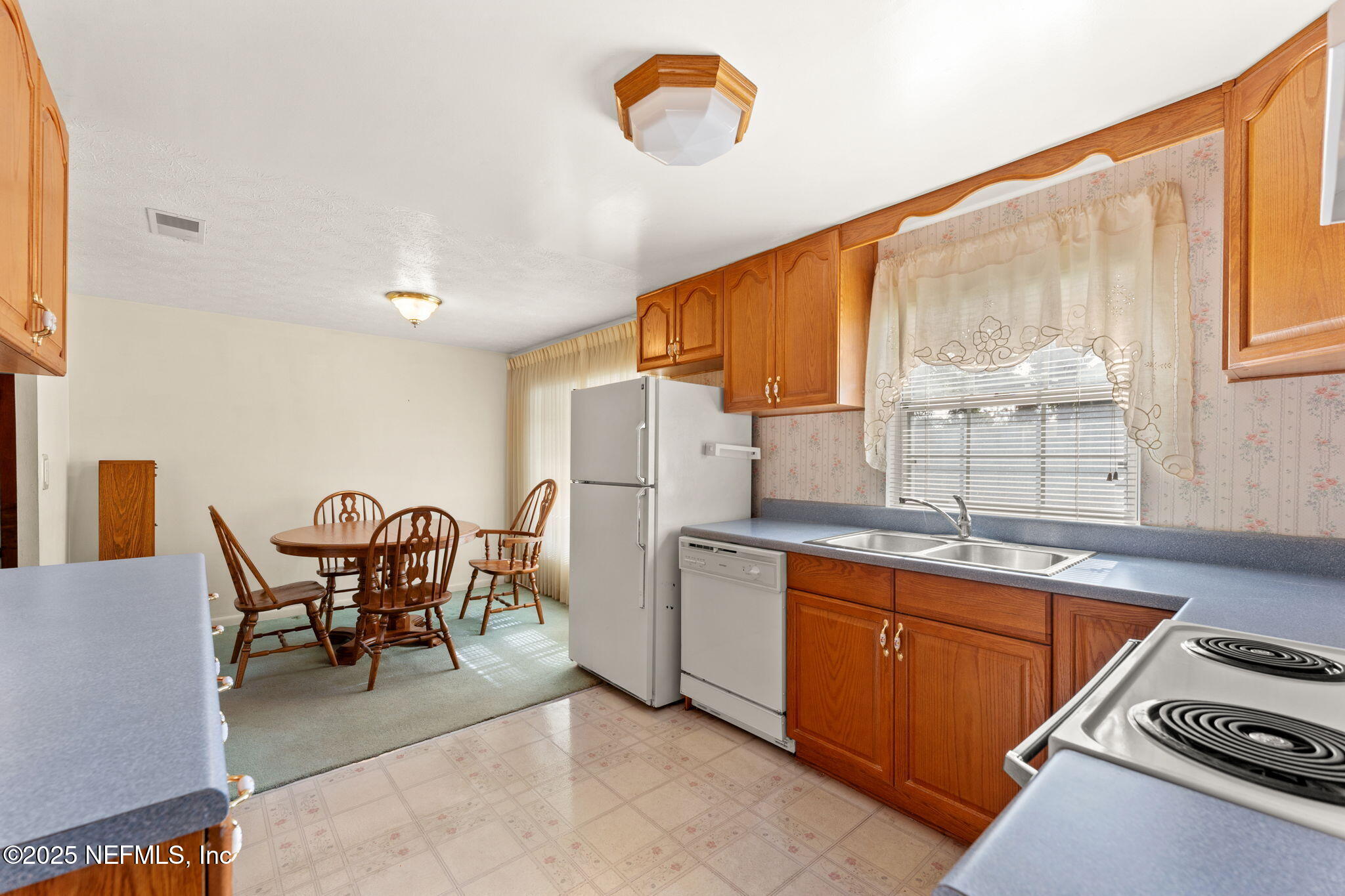 10887 Player Road West Jacksonville, FL 32218 - Photo 11 of 26 a dining room with furniture and a window