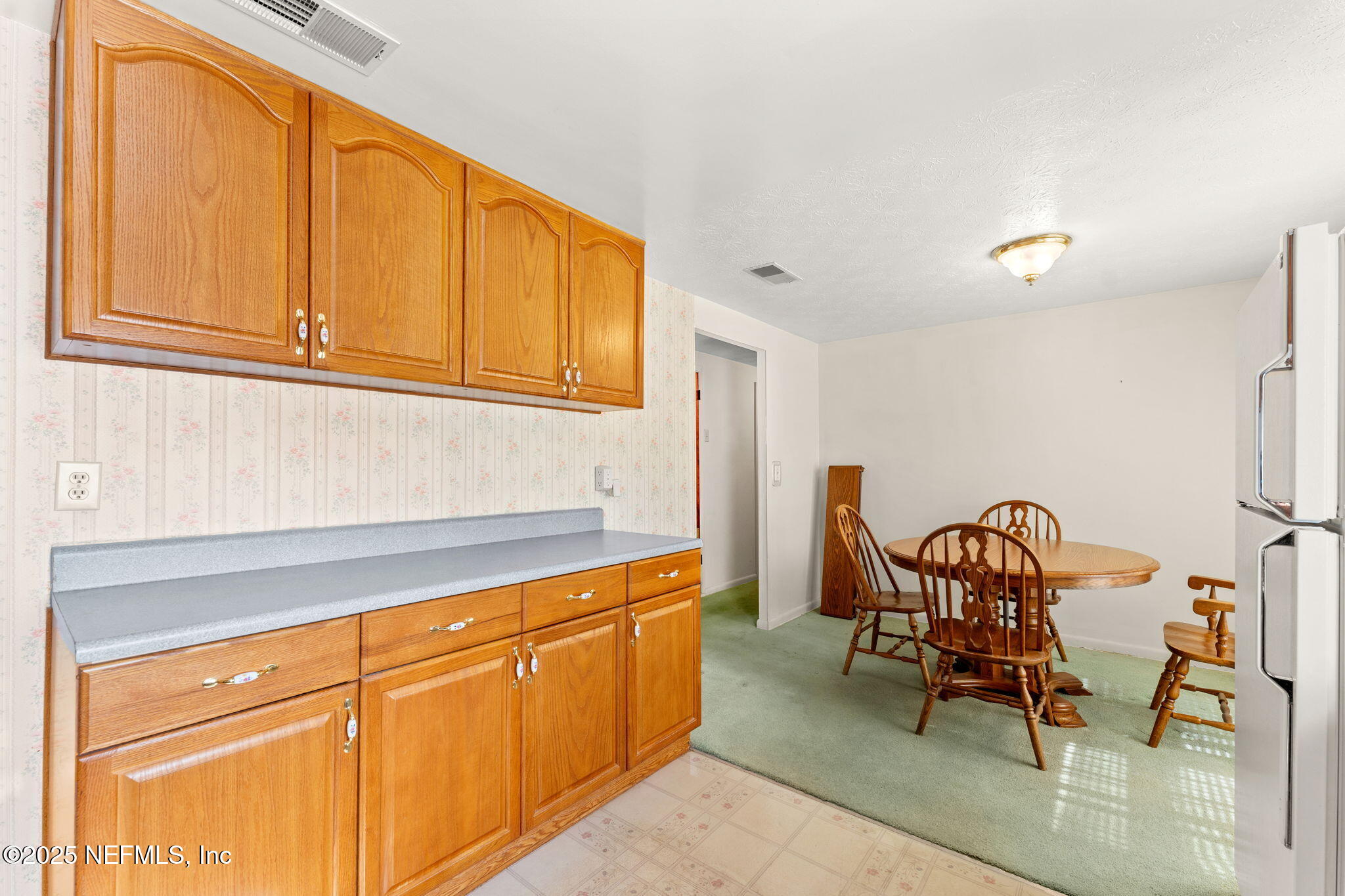 10887 Player Road West Jacksonville, FL 32218 - Photo 12 of 26 a kitchen with stainless steel appliances granite countertop a sink and cabinets