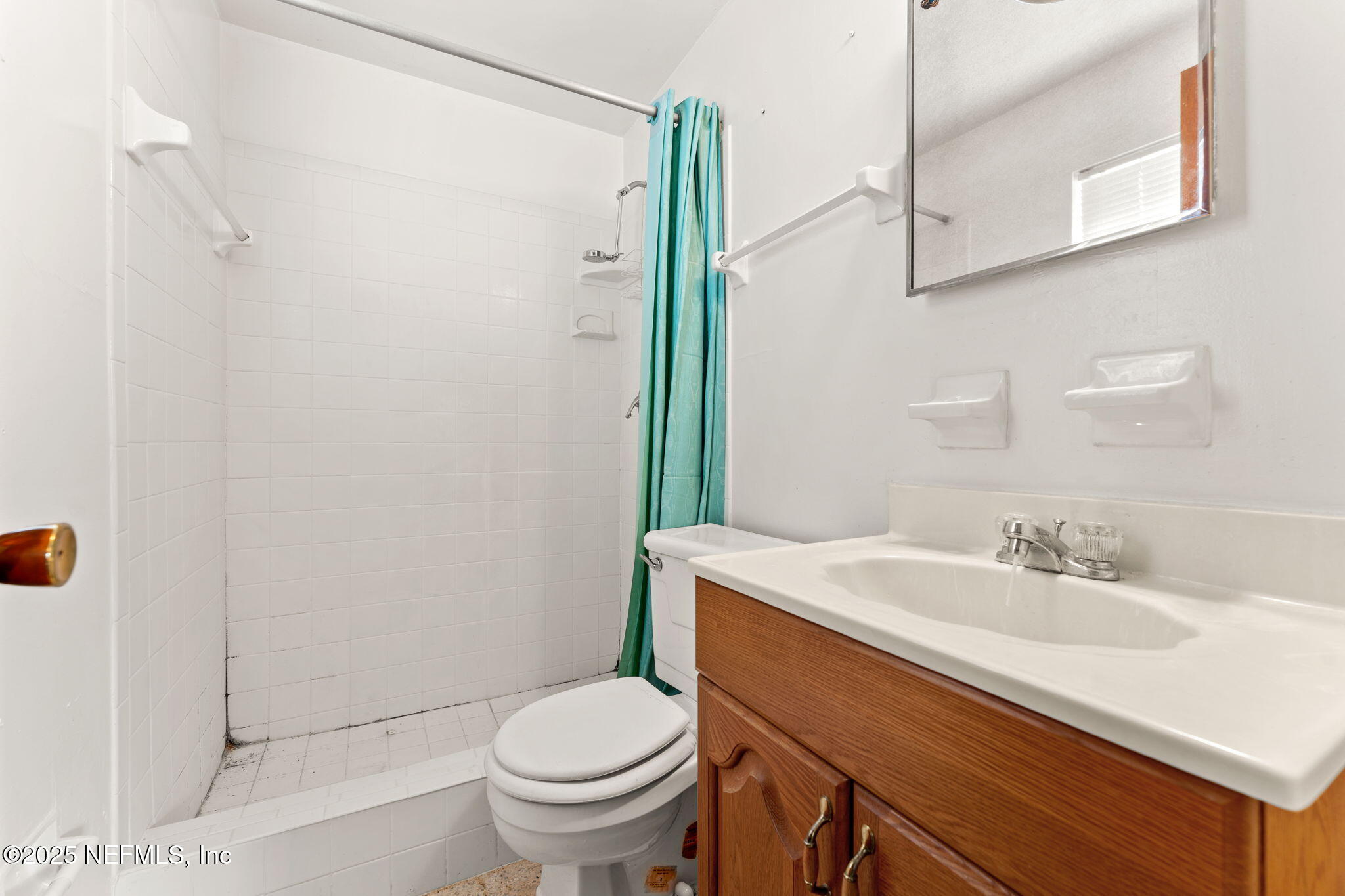 10887 Player Road West Jacksonville, FL 32218 - Photo 18 of 26 a bathroom with a sink a toilet and shower