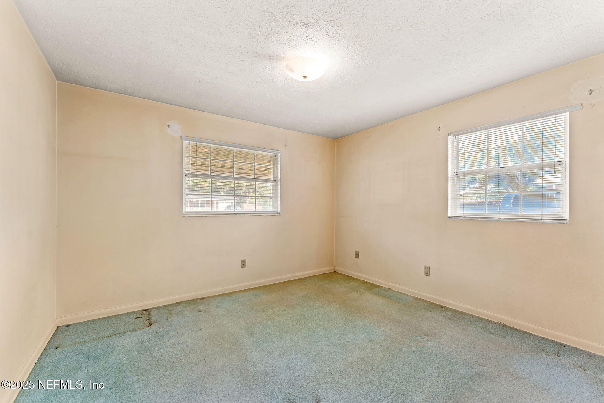 10887 Player Road West Jacksonville, FL 32218 - Photo 19 of 26 an empty room with a window