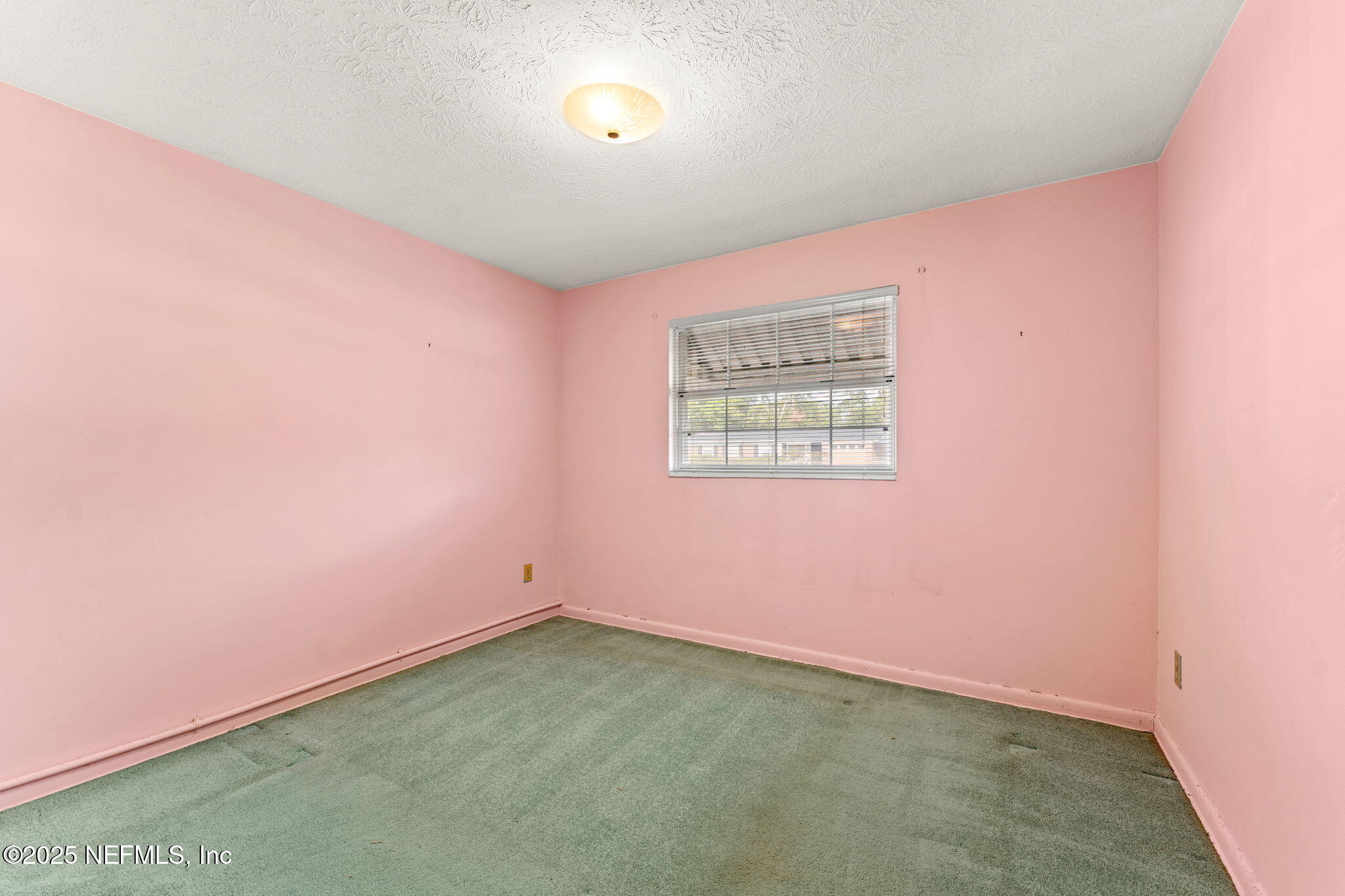10887 Player Road West Jacksonville, FL 32218 - Photo 20 of 26 an empty room with a empty space and a window