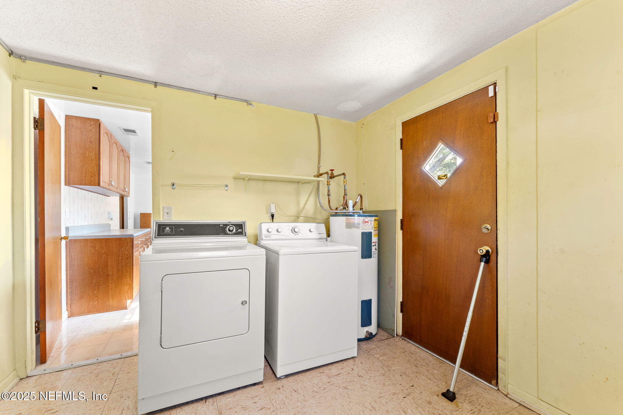 10887 Player Road West Jacksonville, FL 32218 - Photo 22 of 26 a room with storage and utility