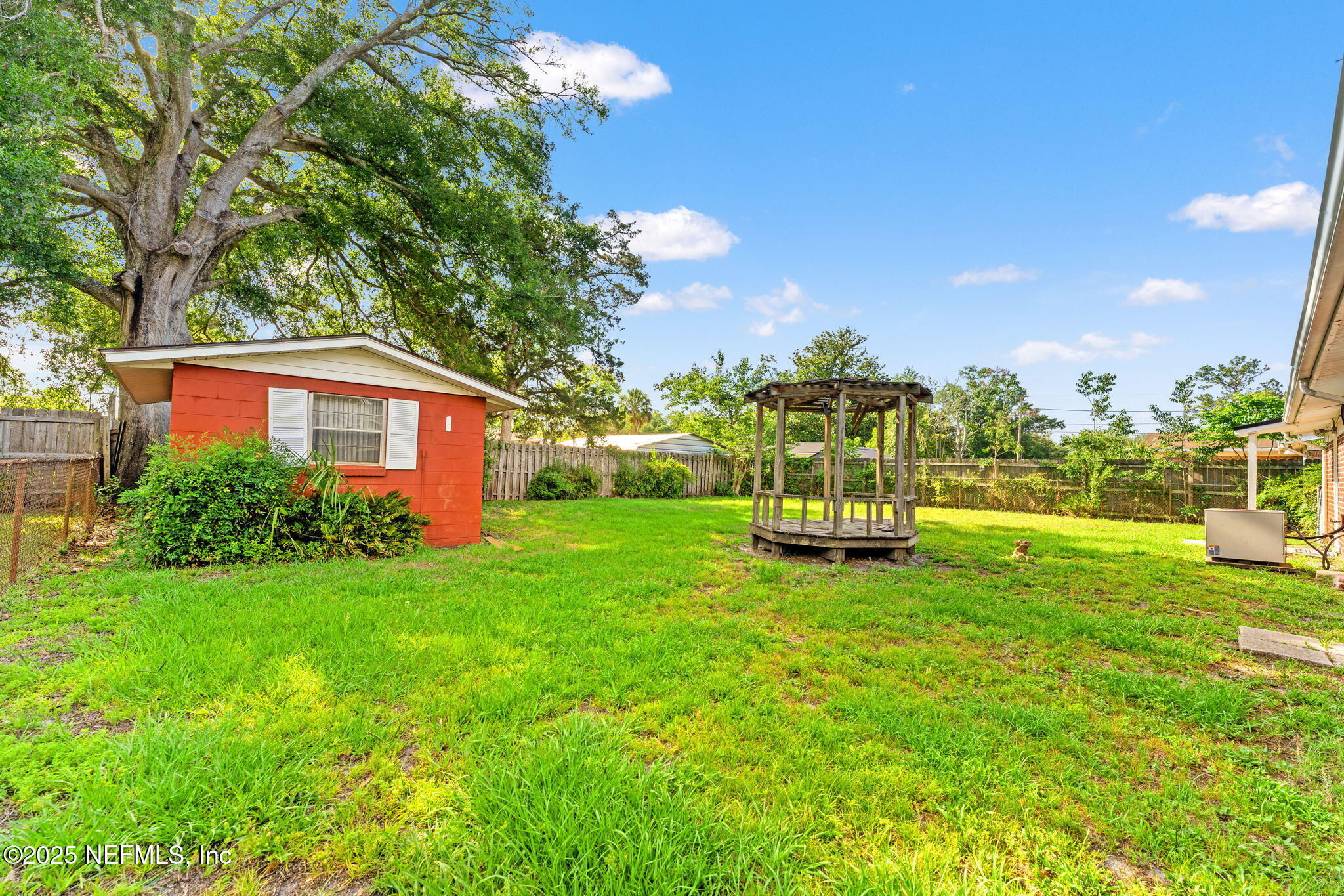 10887 Player Road West Jacksonville, FL 32218 - Photo 23 of 26 a view of a house with a backyard