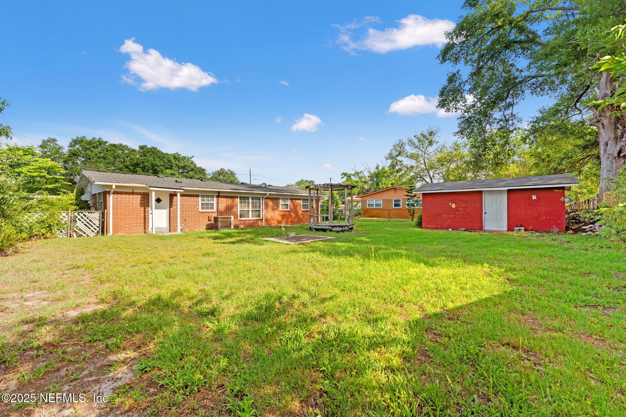10887 Player Road West Jacksonville, FL 32218 - Photo 24 of 26 a view of a house with a backyard