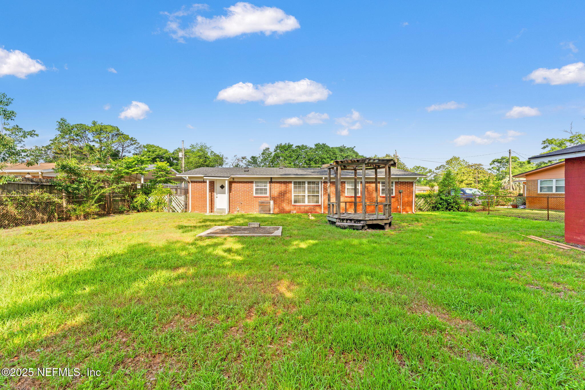 10887 Player Road West Jacksonville, FL 32218 - Photo 25 of 26 a view of a house with a yard