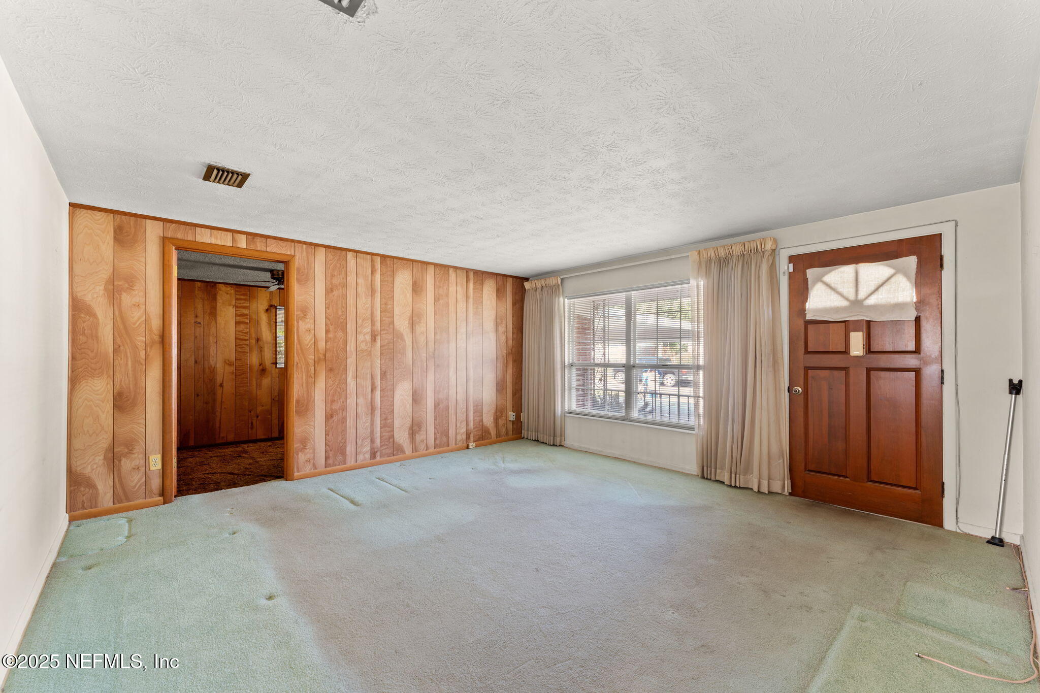 10887 Player Road West Jacksonville, FL 32218 - Photo 4 of 26 a view of an empty room with a window