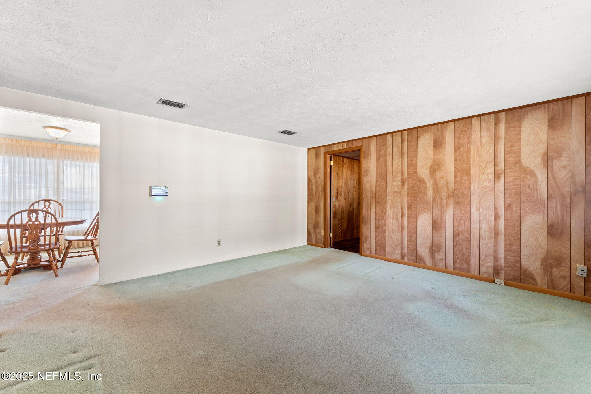 10887 Player Road West Jacksonville, FL 32218 - Photo 5 of 26 a view of an empty room with a window