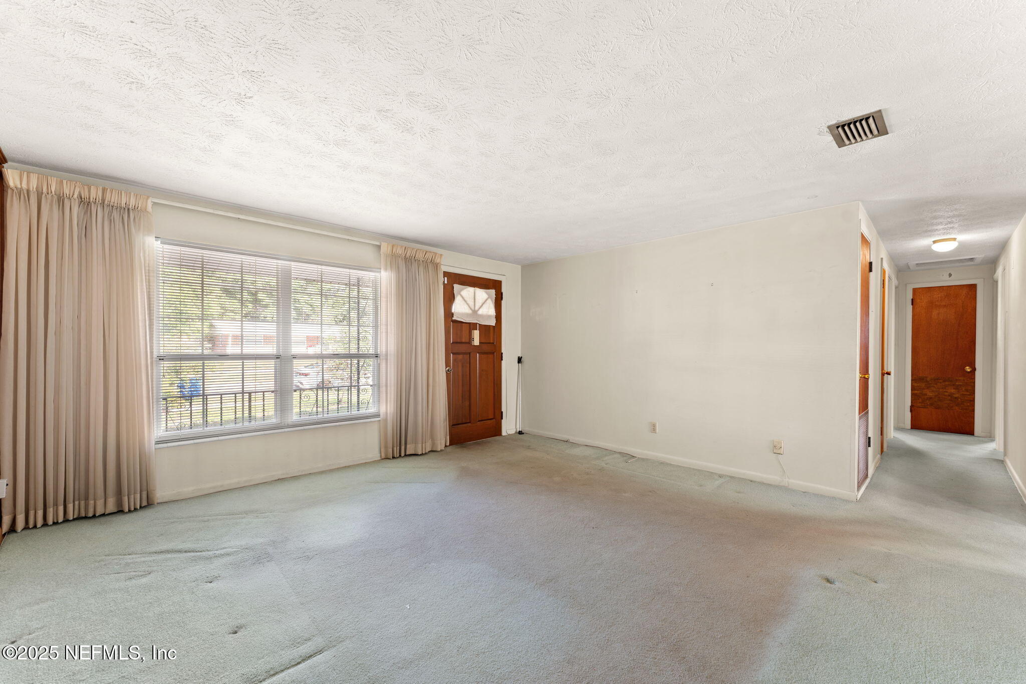 10887 Player Road West Jacksonville, FL 32218 - Photo 6 of 26 an empty room with windows