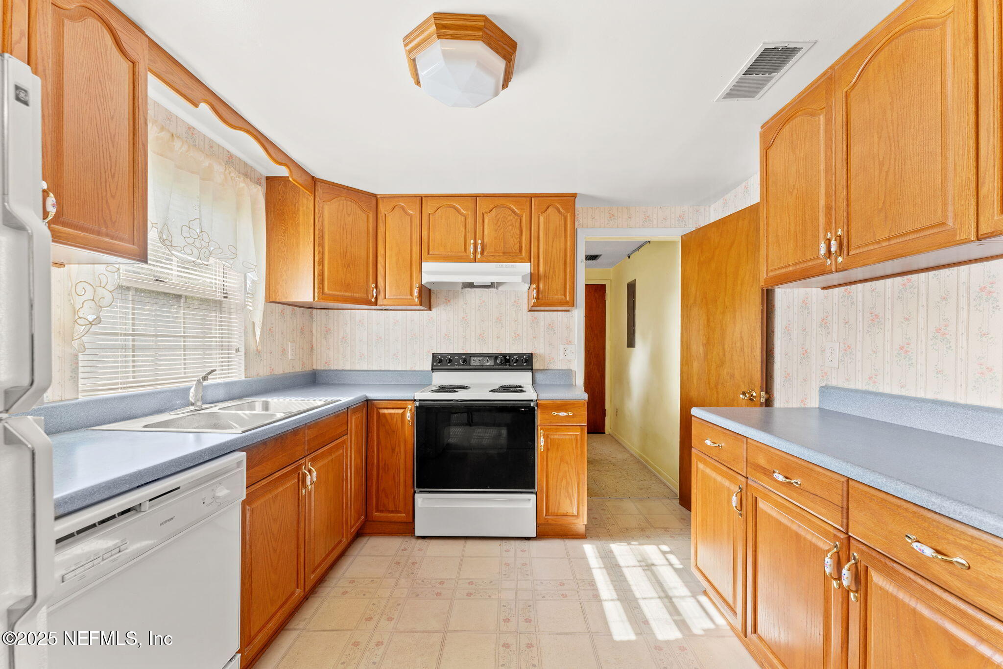 10887 Player Road West Jacksonville, FL 32218 - Photo 9 of 26 a kitchen with stainless steel appliances granite countertop a sink and a stove