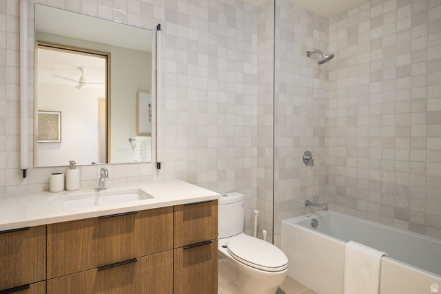 214 Lionsback Loop, Unit 37 Moab, UT 84532 - Photo 16 of 21 Bathroom featuring a wood-finish vanity with a white countertop and integrated sink