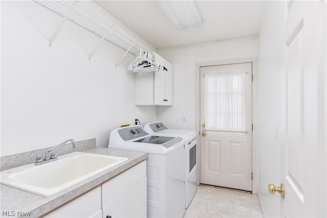 603 South Raccoon Road, Unit 52 Youngstown, OH 44515 - Photo 16 of 29 The laundry room is conveniently located on the first floor. No need to go up and Lots of space and includes a large utility tub. The door leads out to the patio.